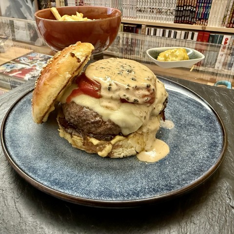 First burger, with cantal, preserved tomatoes and pepper sauce