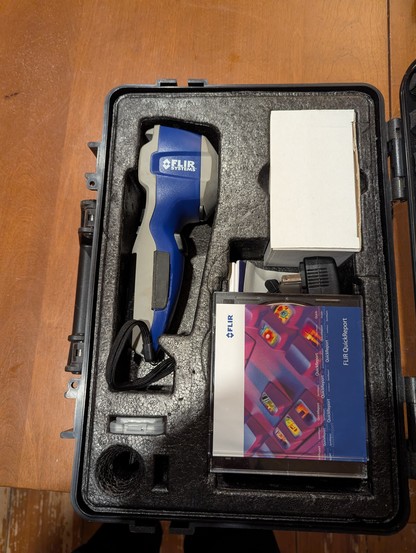 Flir with extras including CDs no longer usable I am sure.
