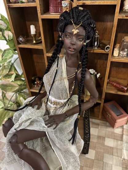 "This is Aminata. She is an Aziza which is a type of fairy from West African Folklore. She loves collecting trinkets and exploring."