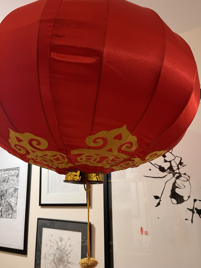 Chinese New Year balloon in front of ink painting 