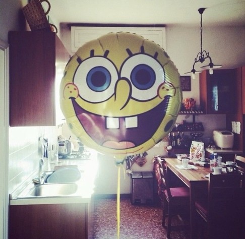 crinkle inflated SpongeBob squarepants balloon in small kitchen dining room space