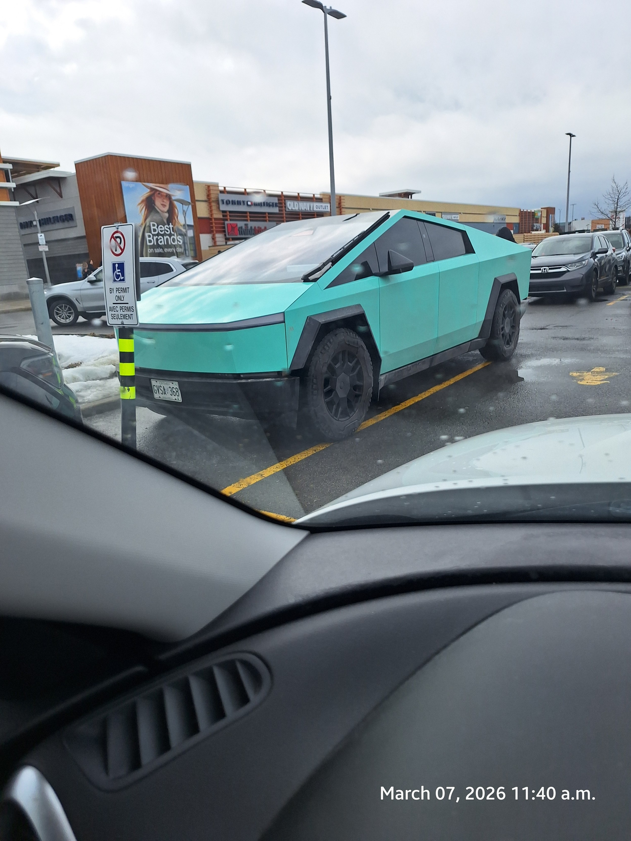 Ugly green Tesla cyber truck.