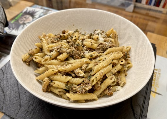Dish of penne rigate. The sauce is made using garlic, sage, basil, dried porcini, walnuts and cream. Parmesan sprinkled when serving.