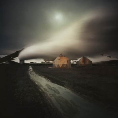 geometric igloos in lapland. smoke, night