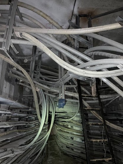 dark twisty pipes and racks and tunnel