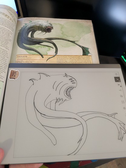 5e monster manual open to the Aboleth, a fish monster. Laid on it is a line drawing of the monster