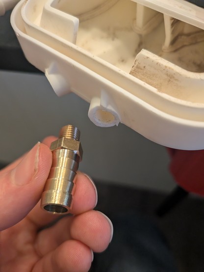 Snapped off plastic barbs with the replacement brass barb.