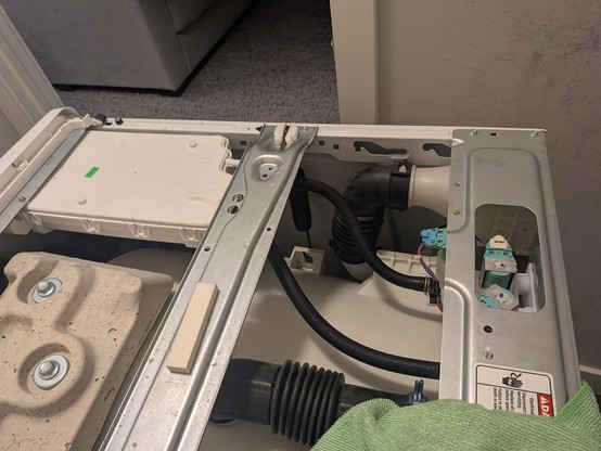 Washing machine back together. The repair is under the supporting bar.