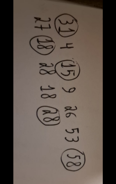 Fornecido por @altbot, gerado localmente e de forma privada usando Gemma4:26b e editado pelo autor do toot:
Uma fotografia de um papel branco com duas colunas de números escritos à  mão. Alguns números estão destacados por círculos. A coluna à direita contém os dígitos de pi: os números 31 (circulado), 4, 15 (circulado), 9, 26, 53 e 58 (circulado). A coluna à esquerda contém os dígitos de "e": os números 27, 18 (circulado), 28 (circulado), 18 e 28 (circulado).