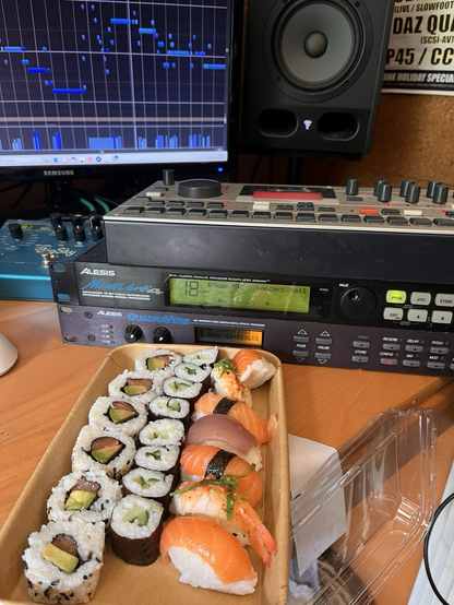 Large amount of sushi on studio desk 