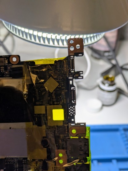 A bunch of tiny vias all cleared of old solder in preparation for a new part