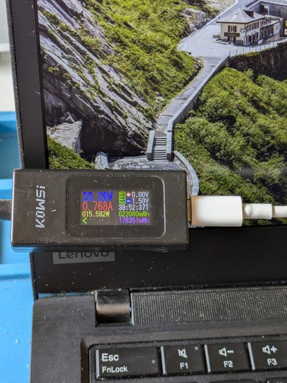 Meter showing reassembled laptop negotiating correct voltage via USB-C PD