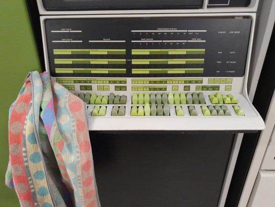 A close-up of the PDP-12 console with a towel hanging from it.