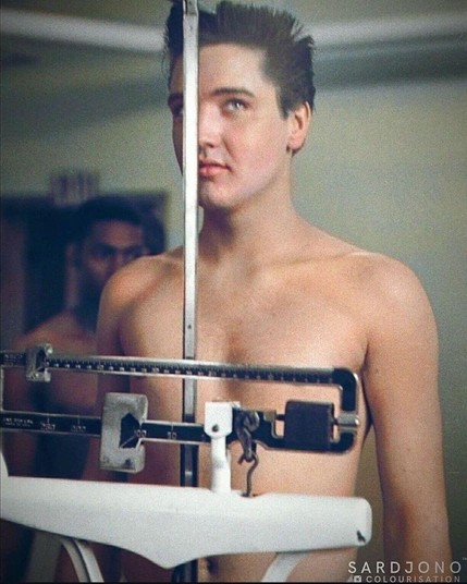 "Elvis Presley undergoing a physical examination on March 24, 1958, his first full day in the U.S. Army at Fort Chaffee, Arkansas.
He was drafted at the height of his fame and served for two years, primarily stationed in Friedberg, Germany. During his service, he worked as a jeep driver and was promoted to sergeant before being honorably discharged in 1960.
The original black-and-white photograph has been colorized by Sardjono Colourisation."