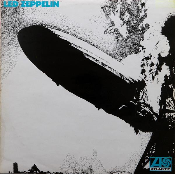 The cover of Led Zeppelin I. The Hindenburg bursts into flames, with a tower to the right. The title reads "Led Zeppelin" in a 1960s-style blocky font.