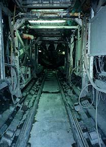wires and pipes of dark tunnel
