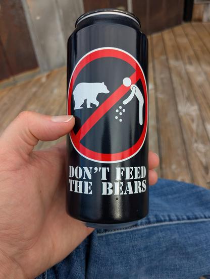 Black beer can that says "Don't feed the bears"