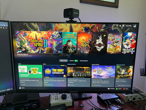 The SteamOS UI showing a list of games and game-related updates.