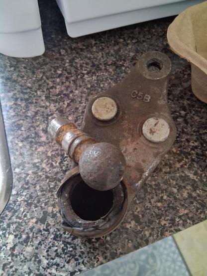 A worn-out ball joint in two pieces