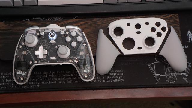 The GameSir G7 Pro Tri-Mode controller partially disassembled on the left, and the top of the grips along with the faceplate on the right.