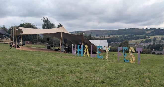 The main stage of Whaley fest, the sign and hills in the background