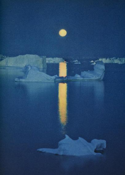 hjalmar petersen greenland rick stevens. yellow moon over blue night and glacier and ice and snow