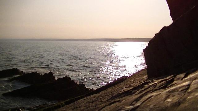 early morning sea view from a sea rock with rocky outcrops. sky still a bit orange. sun reflected on sea but not low enough to be in shot. i might toot another sea sunrise snap from the other week later cuz i like 'em. and i got loads.
