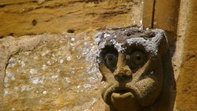 i don't half type some crap sometimes. well anyway, its a monkey-cat like face carved in orange sand stone. hood mould thingy from the same church as the other day. i suppose what i was trying to say is that it ain't blurry. sometimes you have to get the snap from a decent angle to get the proper facial features and because they are high up and well out of reach, you have to stand far away. this means you have to have lots of zoom on the camera, so you have to hope there is a gravestone or some…
