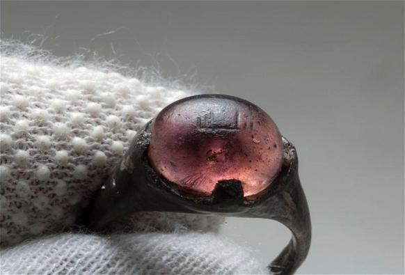 A Viking era ring inscribed with the words 'for Allah', found in the grave of a woman who was buried 1200 years ago in Birka, 25 km west of modern-day Stockholm. The ring constitutes a unique material evidence of direct contact between the Vikings and the Abbasid Caliphate 