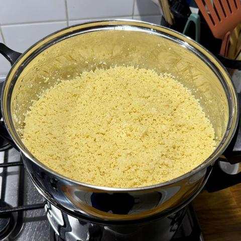 And the couscous semola goes on top of all this in its basket to cook in the steam. There's an indecent amount of butter in there, not visible.