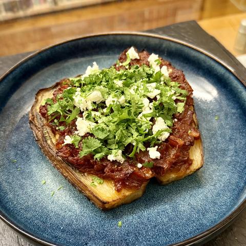 Eggplant kind of stuffed with a sauce made with tomato and onions. So many onions. So much olive oil. Bliss.

I tried with some feta and parsley on top this time, will try Parmesan next time