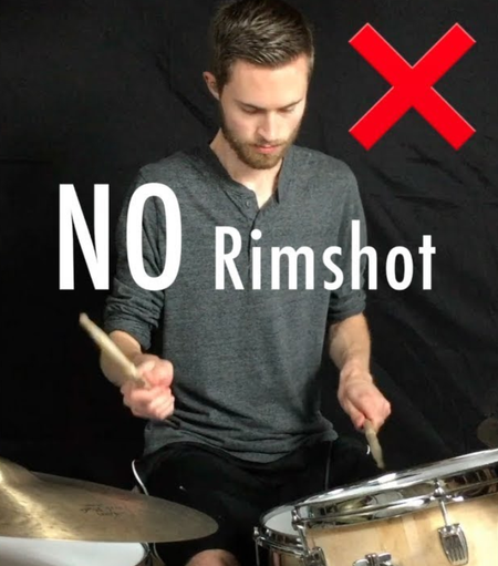 An image of a guy at a drum set labeled "NO Rimshot"