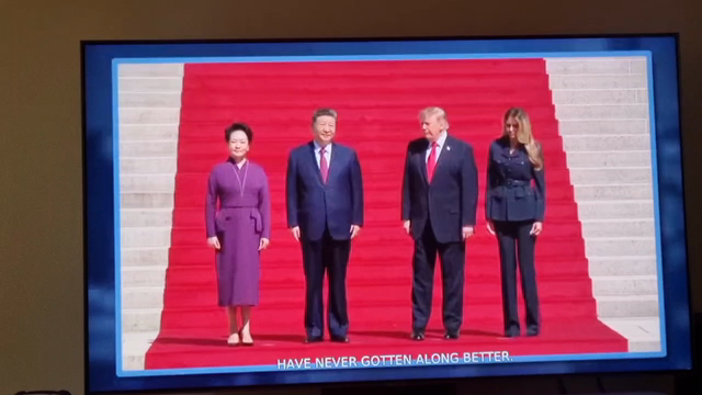 Video of Presidents Xi and Trump, in that order, walking up stairs with their respective on either side. Xi takes hold of his wife's hand, Trump seeks out with his left hand until Xi reaches out with his right and they walk up hand in hand, Melania walking up holding nobody's hand