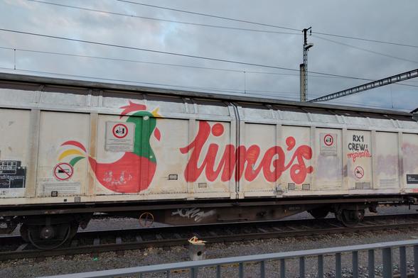 A grafiti on a train wagon that mimics the old Kellogg's logo.