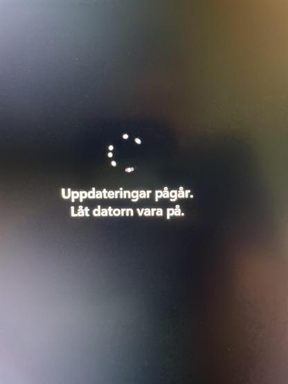 A photo of my screen with text informing me that the computer is updating - it has been the same for over 1 hour when I took the picture